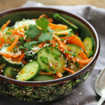 Cucumber and carrot salad with a handwritten recipe card