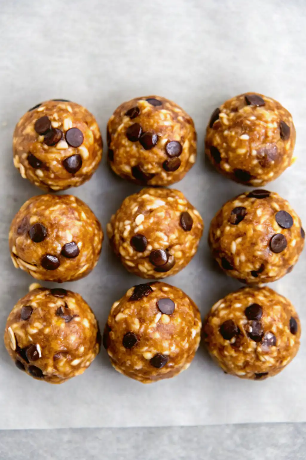 Stirring together peanut butter oatmeal energy ball mixture