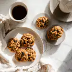 oatmeal raisin cookies no bake arranged on a plate with coffee