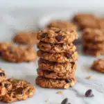 Healthy no bake protein cookies on plate with chocolate chips.