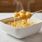 Spoonful of Hearty Cheddar Garlic Herb Potato Soup.