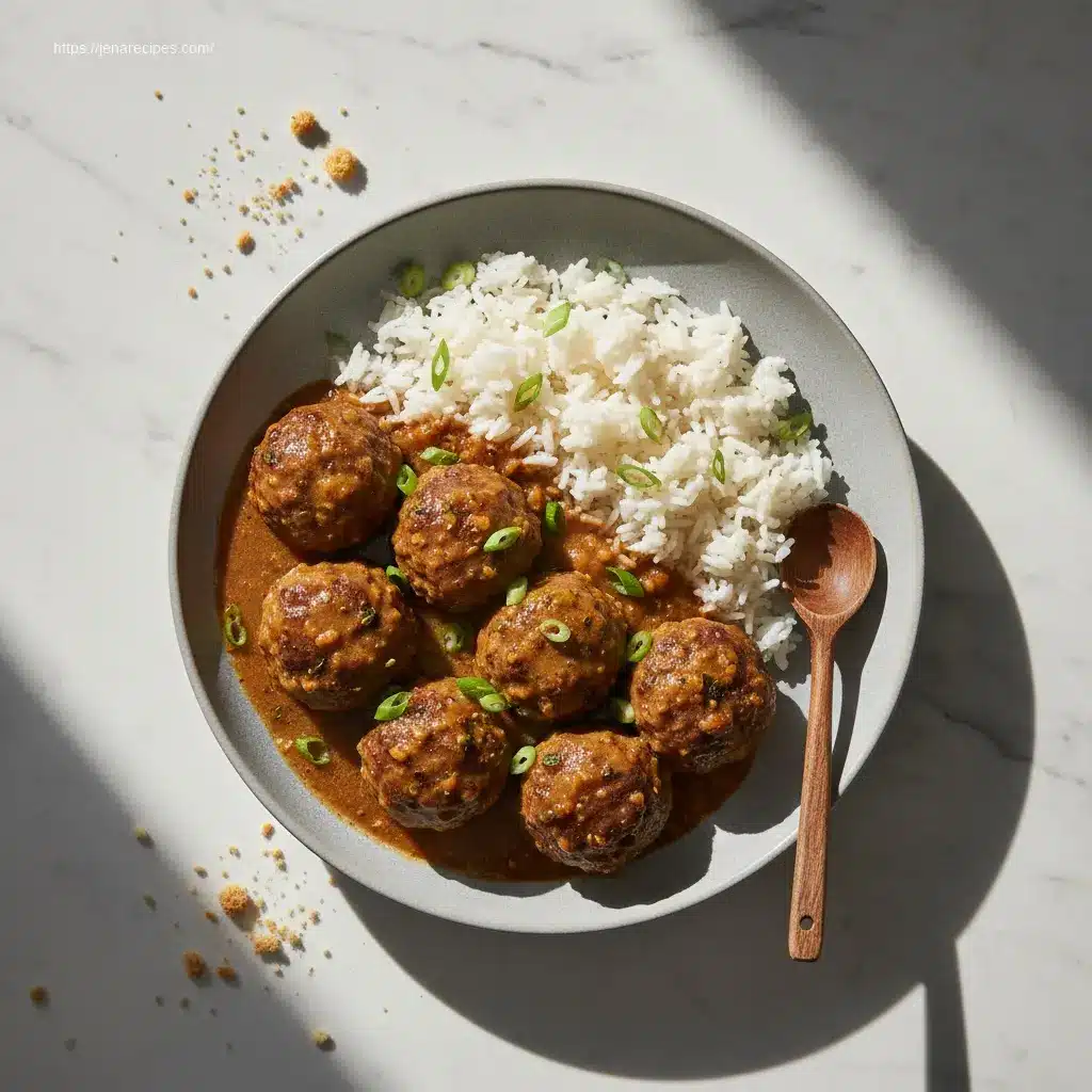 Close-up of Slow Cooker Salisbury Steak Meatballs with mashed potatoes.