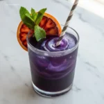 Close-up of Witches Brew Lemonade being stirred with a straw