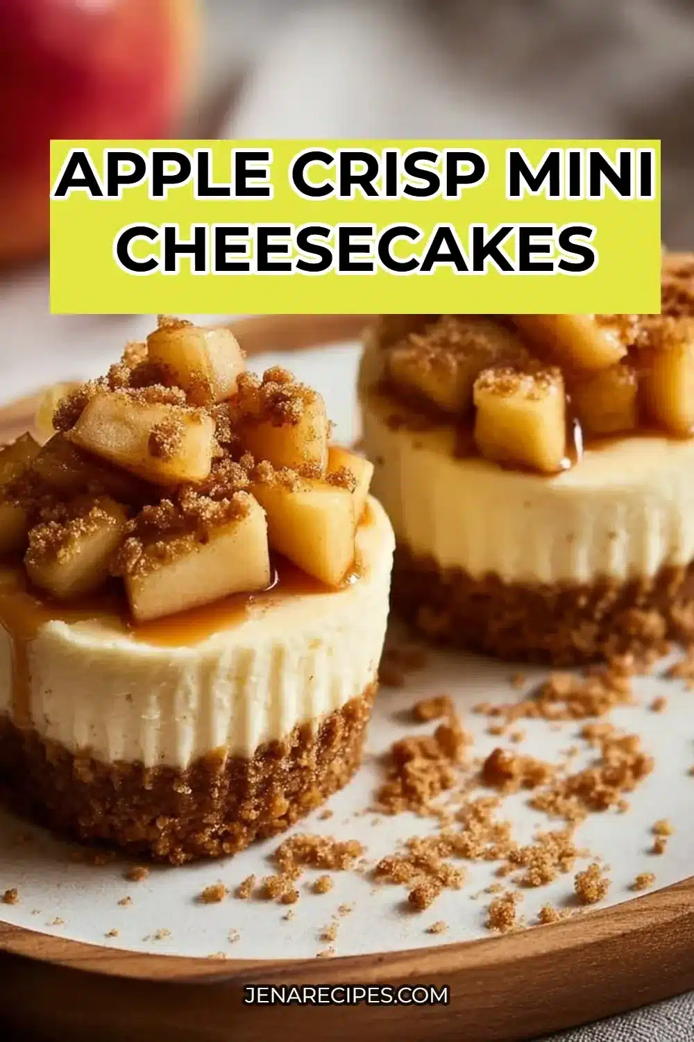 Mini apple crisp cheesecakes topped with crumble and apple slices