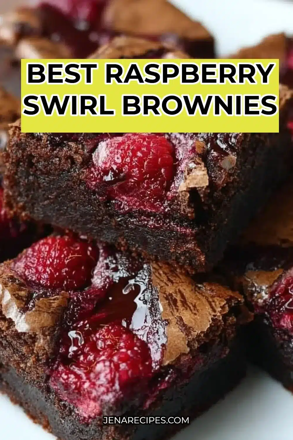 Delicious raspberry swirl brownies topped with fresh raspberries and chocolate