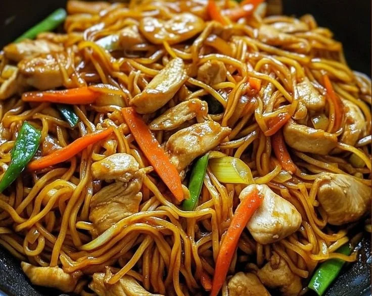 Delicious plate of Chicken Lo Mein with vegetables and noodles