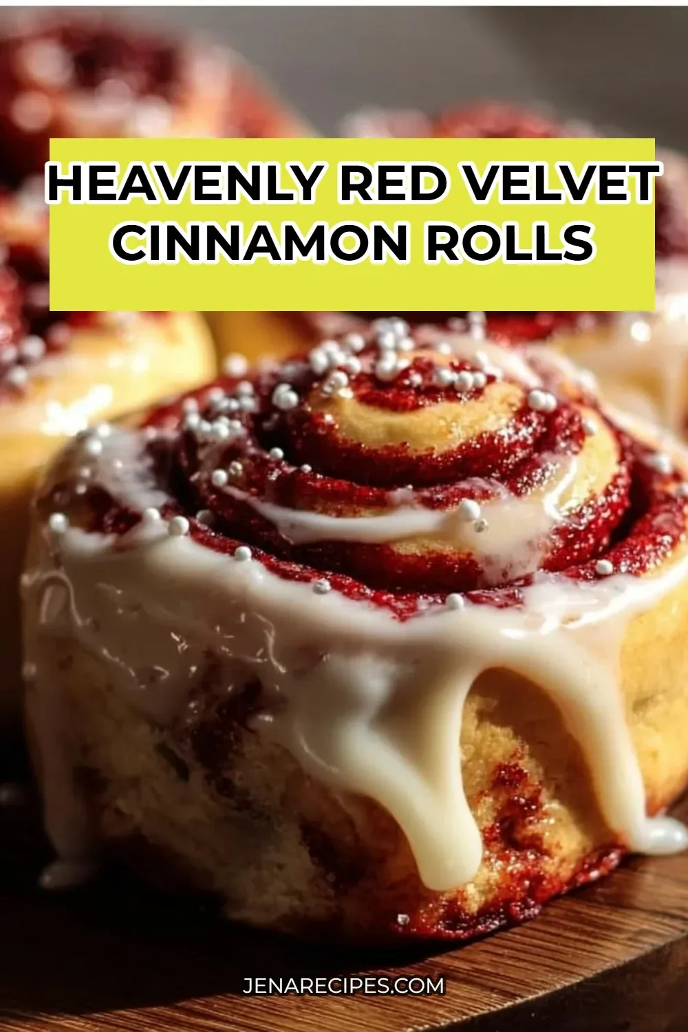 Freshly baked red velvet cinnamon rolls topped with cream cheese icing