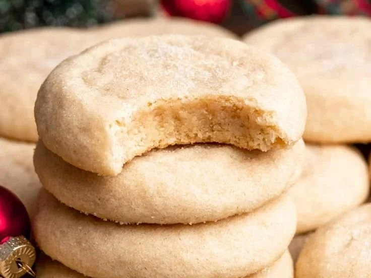Delicious soft and chewy sugar cookies on a cooling rack