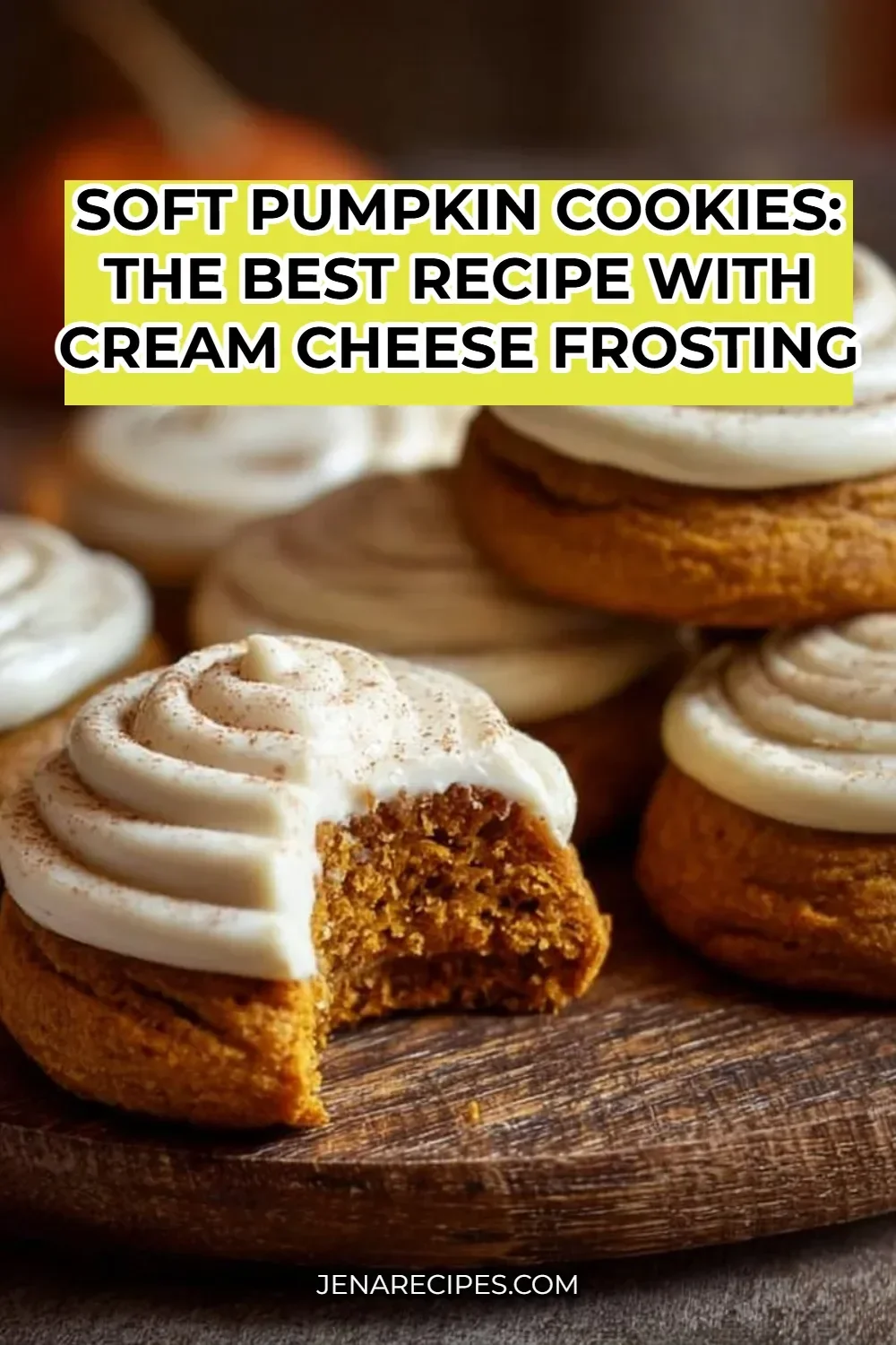Delicious soft pumpkin cookies with cream cheese frosting on a rustic plate.