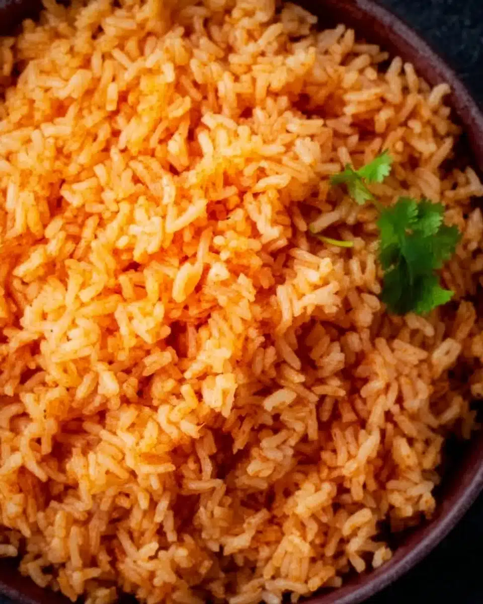 Bowl of authentic Mexican rice served with traditional garnishes