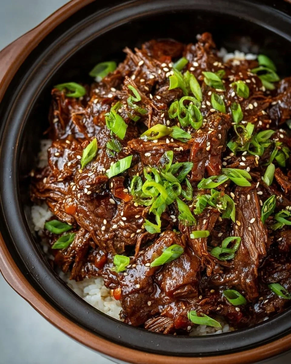 Bowl of Easy Slow Cooker Korean Beef served with rice and vegetables