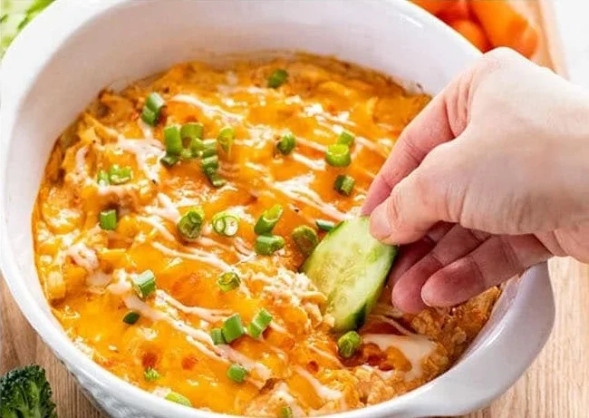 Healthy Buffalo Chicken Dip served in a bowl with fresh veggies for dipping