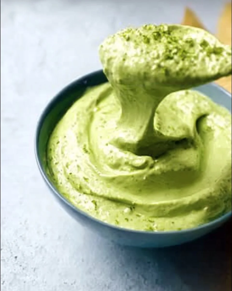 Delicious avocado cream sauce drizzled over a fresh salad