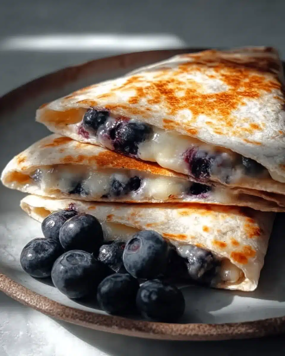 Delicious blueberry quesadilla with melted cheese and fresh blueberries.